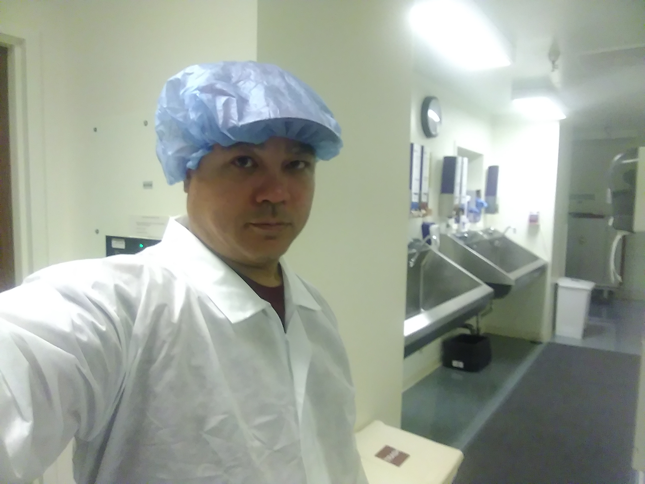 Biomedical technician in clinical scrub area performing field service
